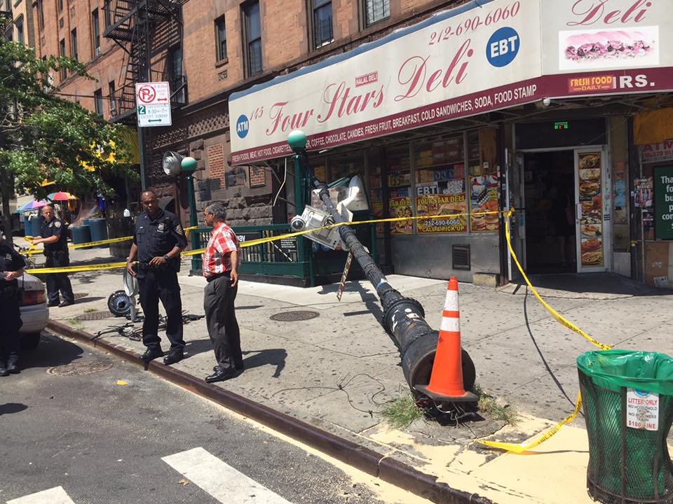 Car Accident Sends Traffic Pole Crashing Into Subway Entrance In Harlem